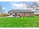 Spacious backyard featuring a patio with outdoor furniture and lush green lawn at 1707 Lafayette Ave, Lebanon, IN 46052