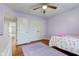 Charming bedroom with ceiling fan and a purple area rug at 1707 Lafayette Ave, Lebanon, IN 46052