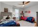Fun bedroom featuring ceiling fan and twin beds with superhero themes at 1707 Lafayette Ave, Lebanon, IN 46052