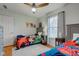bedroom featuring twin beds, ceiling fan, and window with natural light at 1707 Lafayette Ave, Lebanon, IN 46052