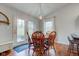 Bright dining area with backyard access, featuring an pendant light and seamless kitchen access at 1707 Lafayette Ave, Lebanon, IN 46052