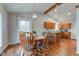 Charming dining area featuring a stylish light fixture, round table, and seamless kitchen access at 1707 Lafayette Ave, Lebanon, IN 46052