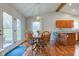 Bright dining area with backyard access, featuring an pendant light and seamless kitchen access at 1707 Lafayette Ave, Lebanon, IN 46052