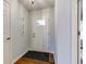 Clean entryway with wood floors and a white front door at 1707 Lafayette Ave, Lebanon, IN 46052