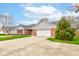 Brick home with attached garage, basketball court, and well-maintained lawn at 1707 Lafayette Ave, Lebanon, IN 46052