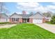 Charming brick home with a well-manicured lawn and an attached two-car garage at 1707 Lafayette Ave, Lebanon, IN 46052