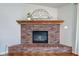 Detailed brick fireplace with mantel and gas insert at 1707 Lafayette Ave, Lebanon, IN 46052