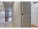 Inviting hallway with wood floors, neutral walls, and view of an open living area, creating a seamless flow at 1707 Lafayette Ave, Lebanon, IN 46052