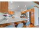 Well-equipped kitchen featuring granite countertops, stainless steel appliances, and modern barstool seating at 1707 Lafayette Ave, Lebanon, IN 46052