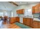 Open kitchen with wooden cabinets, modern appliances, and adjacent dining area, perfect for gatherings at 1707 Lafayette Ave, Lebanon, IN 46052