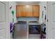 Bright laundry room with appliances and storage cabinets at 1707 Lafayette Ave, Lebanon, IN 46052