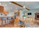 Open concept view of the dining and kitchen area with wood floors and natural light at 1707 Lafayette Ave, Lebanon, IN 46052