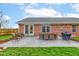 Backyard patio area featuring a grill and dining set, perfect for outdoor entertaining at 1707 Lafayette Ave, Lebanon, IN 46052