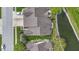 Overhead view of the home showcasing the roof, backyard pond, and patio at 17777 Crown Pointe Ct, Noblesville, IN 46062