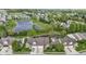 Expansive aerial view shows home's proximity to serene pond and lush green neighborhood at 17777 Crown Pointe Ct, Noblesville, IN 46062