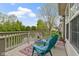 Back deck with two chairs and views of landscaping and the water feature at 17777 Crown Pointe Ct, Noblesville, IN 46062