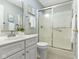 Bathroom featuring a glass shower door, white vanity, neutral walls, and tile flooring at 17777 Crown Pointe Ct, Noblesville, IN 46062
