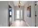 Welcoming foyer with tiled flooring, decorative lighting, and an open view into the living space at 17777 Crown Pointe Ct, Noblesville, IN 46062