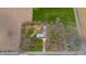 Aerial view of the property with approximate boundary lines, showcasing the home, garage, and surrounding land at 1911 N Rangeline Rd, Anderson, IN 46012