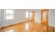 This bedroom boasts hardwood floors, fresh paint, and abundant natural light from the double windows at 1911 N Rangeline Rd, Anderson, IN 46012