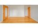 A spacious bedroom featuring hardwood floors and a neutral color palette, offering a versatile living space at 1911 N Rangeline Rd, Anderson, IN 46012