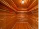 A cedar walk-in closet features wood walls, wood floors, hanging racks, and shelving at 1911 N Rangeline Rd, Anderson, IN 46012
