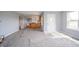 Bright and spacious living room with hardwood floors and an open floor plan to the kitchen at 1911 N Rangeline Rd, Anderson, IN 46012
