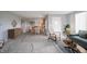 Open-concept living room with a fireplace, dining area, and stylish decor, perfect for entertaining at 1911 N Rangeline Rd, Anderson, IN 46012