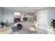 Inviting living room with a fireplace, comfortable seating, and open access to the dining area at 1911 N Rangeline Rd, Anderson, IN 46012
