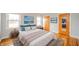 This primary bedroom is bright and spacious and features hardwood floors and decor at 1911 N Rangeline Rd, Anderson, IN 46012