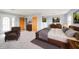 Inviting main bedroom featuring hardwood floors, ample natural light, and neutral decor at 1911 N Rangeline Rd, Anderson, IN 46012