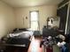 Bedroom with hardwood floors and a window that lets in plenty of natural light at 2208 Avondale Pl, Indianapolis, IN 46218
