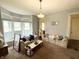 Cozy living room with large windows and comfortable couches perfect for relaxing at 2208 Avondale Pl, Indianapolis, IN 46218