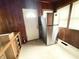 Mud room with a new refrigerator and access to the outside at 2208 Avondale Pl, Indianapolis, IN 46218