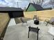Backyard featuring a concrete patio, privacy fence, and modern patio furniture at 2232 Central Ave, Indianapolis, IN 46205