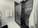 Bathroom features a sleek black tiled shower with glass door and rainfall showerhead at 2232 Central Ave, Indianapolis, IN 46205