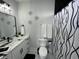 Modern bathroom features black hardware, stylish wall decor, a shower curtain, and white hexagon floor tiles at 2232 Central Ave, Indianapolis, IN 46205