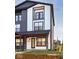 Modern two-story townhouse with white siding, black accents, and a small front yard at 2232 Central Ave, Indianapolis, IN 46205