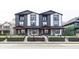 Modern two-story townhouse with black and white siding and a small front yard at 2232 Central Ave, Indianapolis, IN 46205