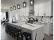 Modern kitchen with white cabinets, black hardware, and a marble waterfall island at 2232 Central Ave, Indianapolis, IN 46205