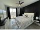 Stunning main bedroom with ceiling fan, TV, luxurious bed and balcony access at 2232 Central Ave, Indianapolis, IN 46205