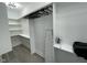Bright walk-in closet with ample shelving and an ironing station at 2232 Central Ave, Indianapolis, IN 46205