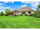 Spacious backyard featuring lush lawn, established landscaping, and charming curb appeal at 2507 Silver Oaks Dr, Carmel, IN 46032