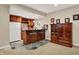A modern bar area includes updated cabinets, appliances, and a tiled floor at 2507 Silver Oaks Dr, Carmel, IN 46032