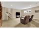 Finished basement provides a cozy space with comfortable seating and great area for relaxation at 2507 Silver Oaks Dr, Carmel, IN 46032