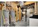 Utility area featuring water heaters and furnace setup, showcasing home's essential systems at 2507 Silver Oaks Dr, Carmel, IN 46032