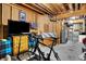 Unfinished basement with exposed beams, a TV, and a bicycle for potential customization at 2507 Silver Oaks Dr, Carmel, IN 46032
