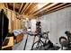 Unfinished basement with exposed beams, concrete walls, and space for a home gym at 2507 Silver Oaks Dr, Carmel, IN 46032