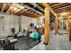Unfinished basement space with exposed ducts and framing with storage and workout equipment at 2507 Silver Oaks Dr, Carmel, IN 46032
