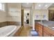 An elegant primary bathroom with a soaking tub, glass shower and double vanity at 2507 Silver Oaks Dr, Carmel, IN 46032